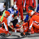 Illustration for article titled Kimi Räikkönen Runs Over Mechanics Leg In Horrific F1 Pit Stop Mishap